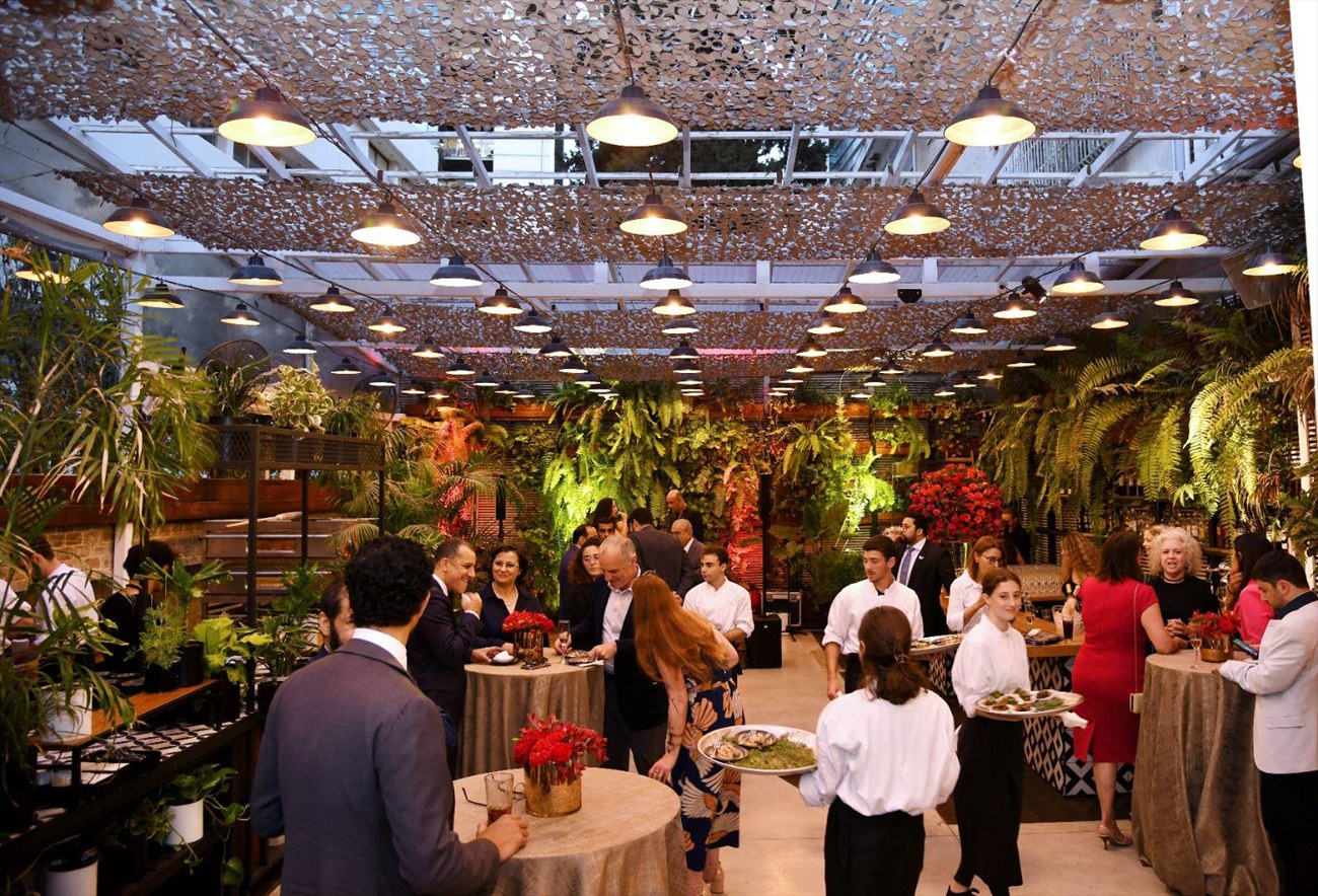 A reception in a planted garden setting.